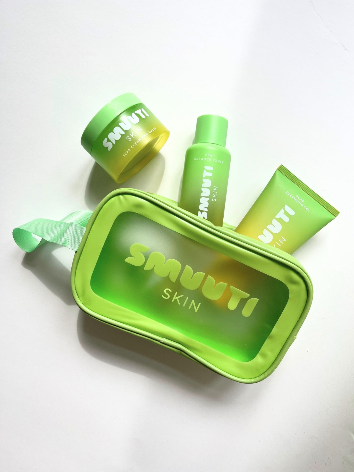 Green skincare product set with Smuuti Skin green makeup bag on a white background