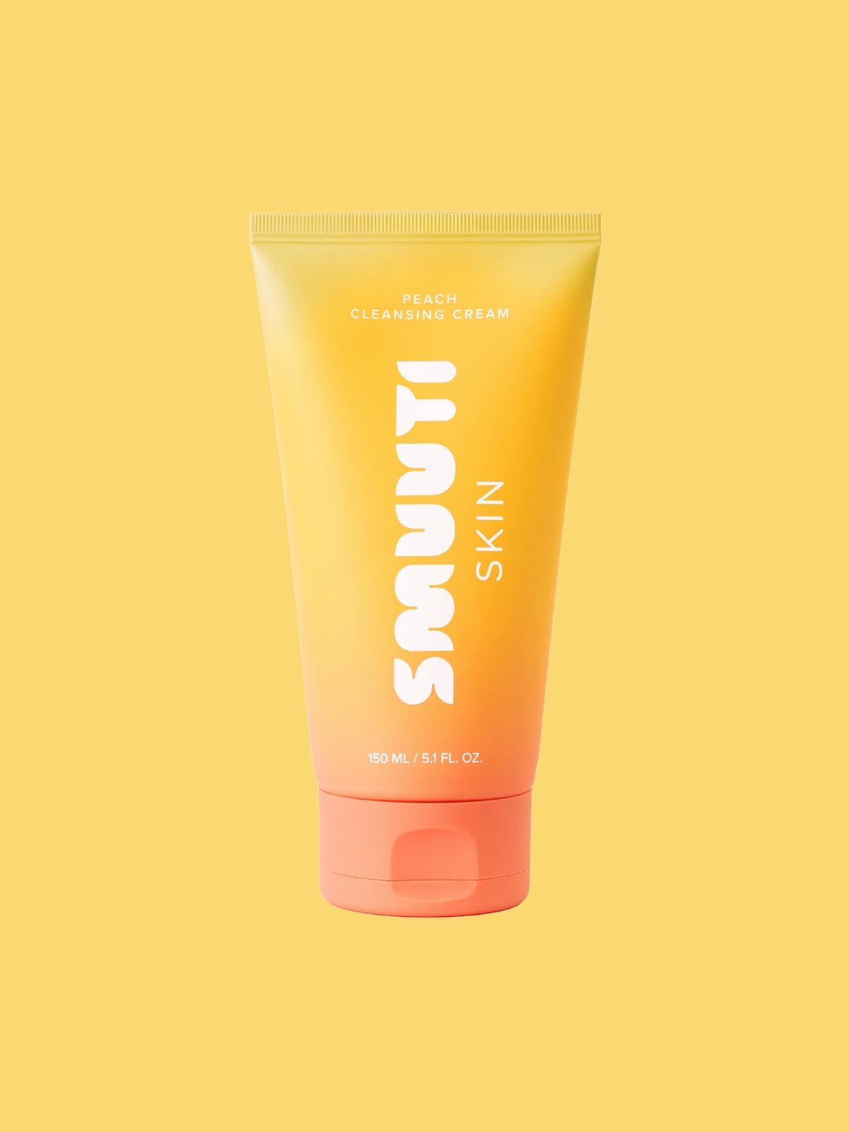 Tube of Smuuti Skin peach cleansing cream on a yellow background