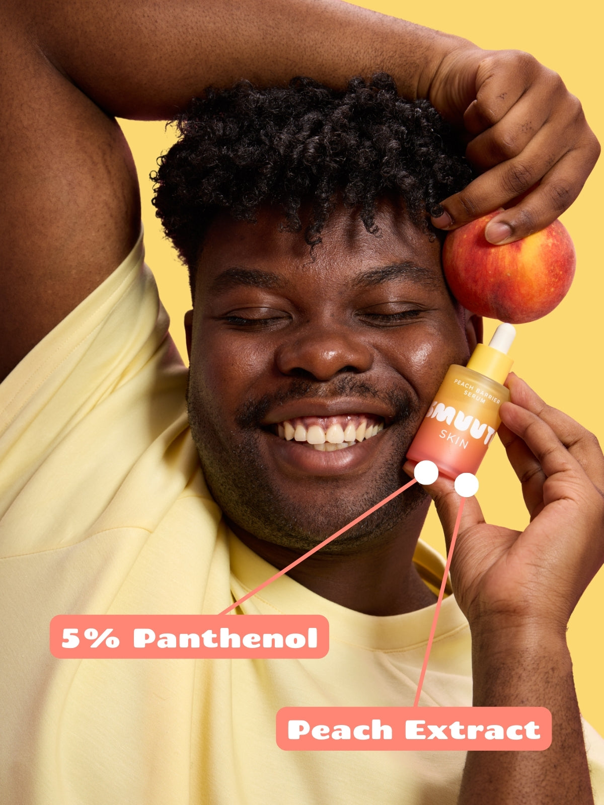 Person holding a peach and a Smuuti Skin peach barrier serum with text '5% Panthenol' and 'Peach Extract' on a yellow background