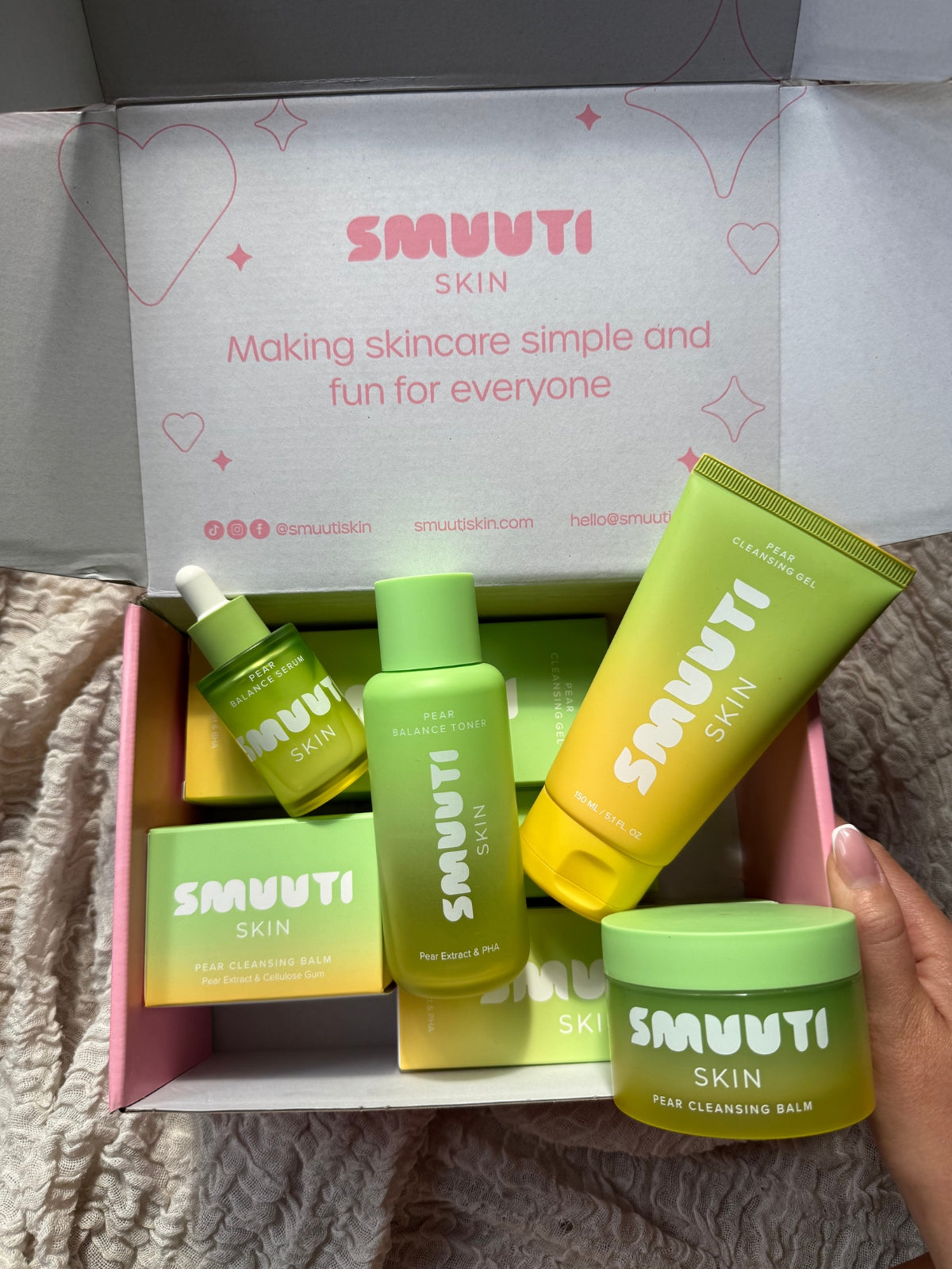 SMUUTI SKIN pear balance skincare products in a box on a textured surface