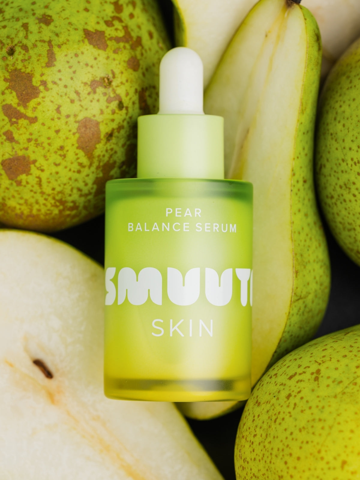Pear Balance Serum bottle with pears in the background