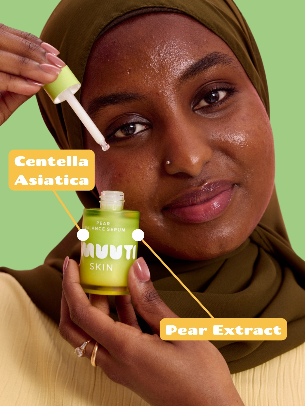 Woman holding Smuuti Skin pear balance serum with text highlighting 'Centella Asiatica' and 'Pear Extract' on a green background