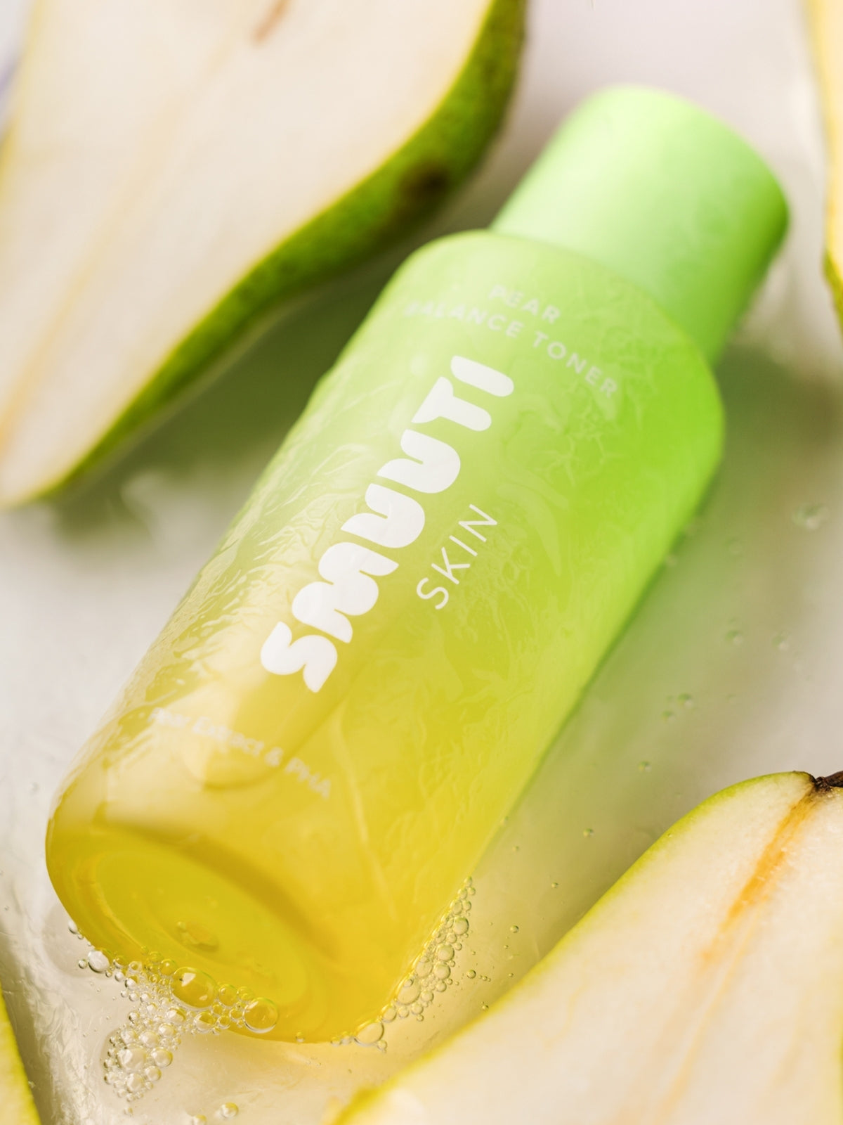 Smuuti Skin pear balance toner with sliced pears on a light background