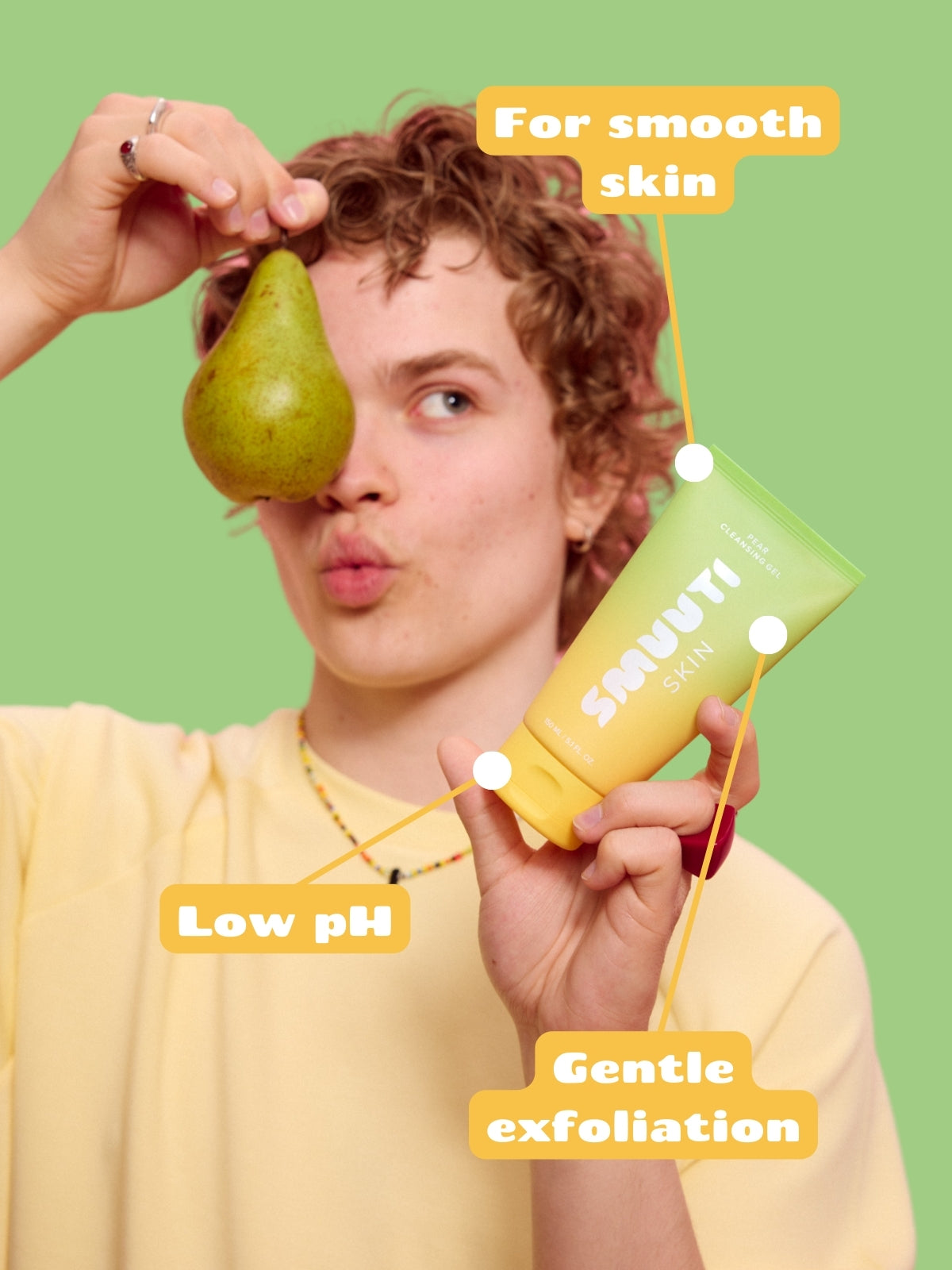 Person holding a pear and pear cleansing gel with text on a green background