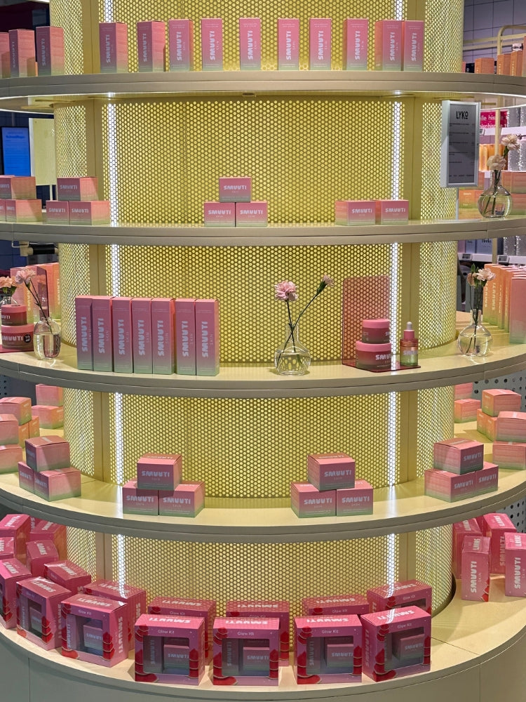 Shelves with Smuuti Skin watermelon dew products on a yellow textured wall in a store