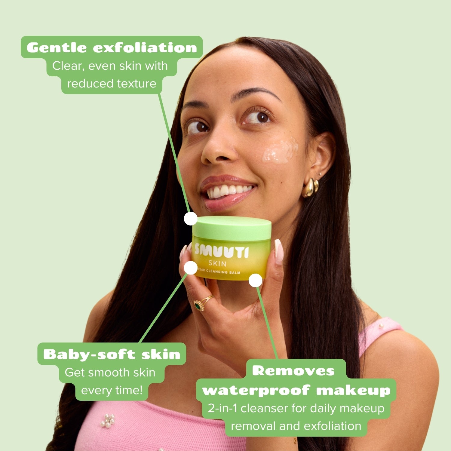 Woman holding a green and yellow container of smuuti skin pear cleansing balm with text about product benefits on a light green background