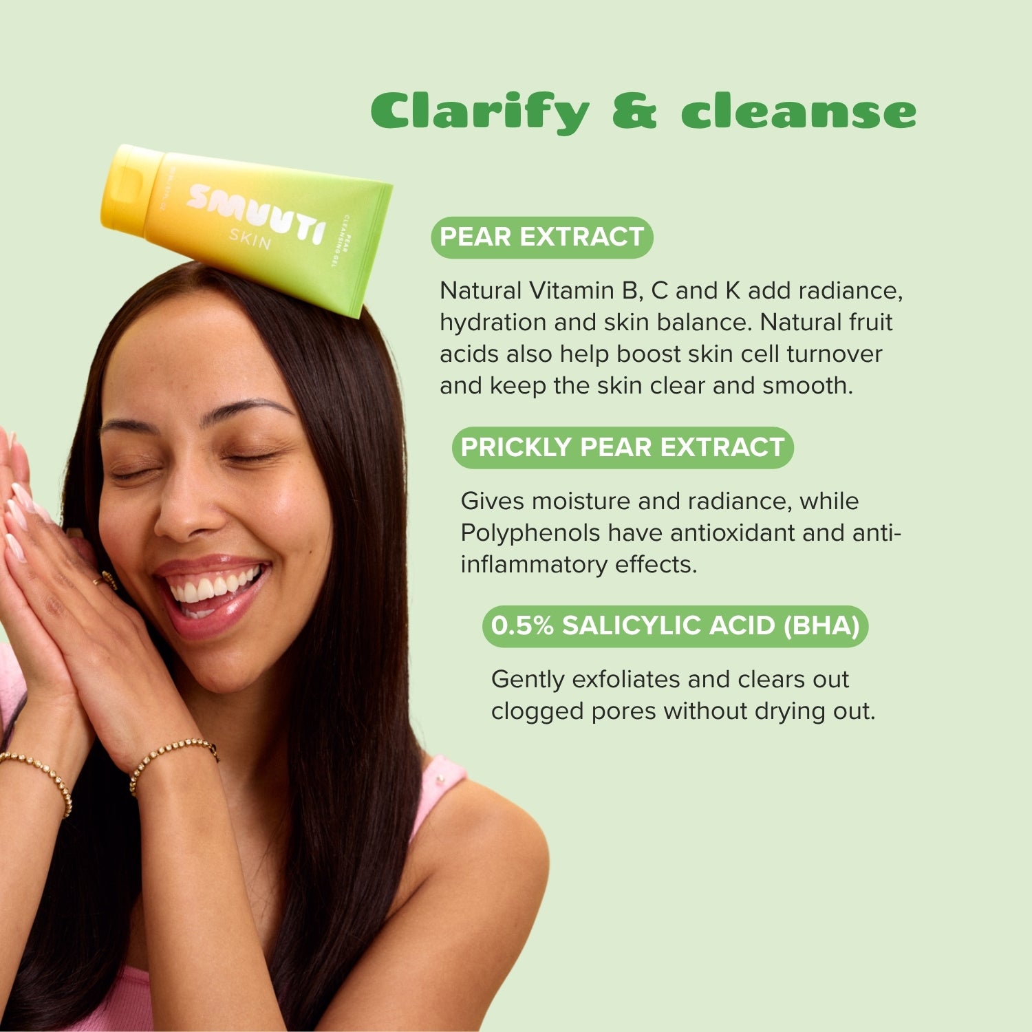 Woman with smuuti skin pear cleansing gel balanced on her head, with text about pear extract and salicylic acid on a light green background.