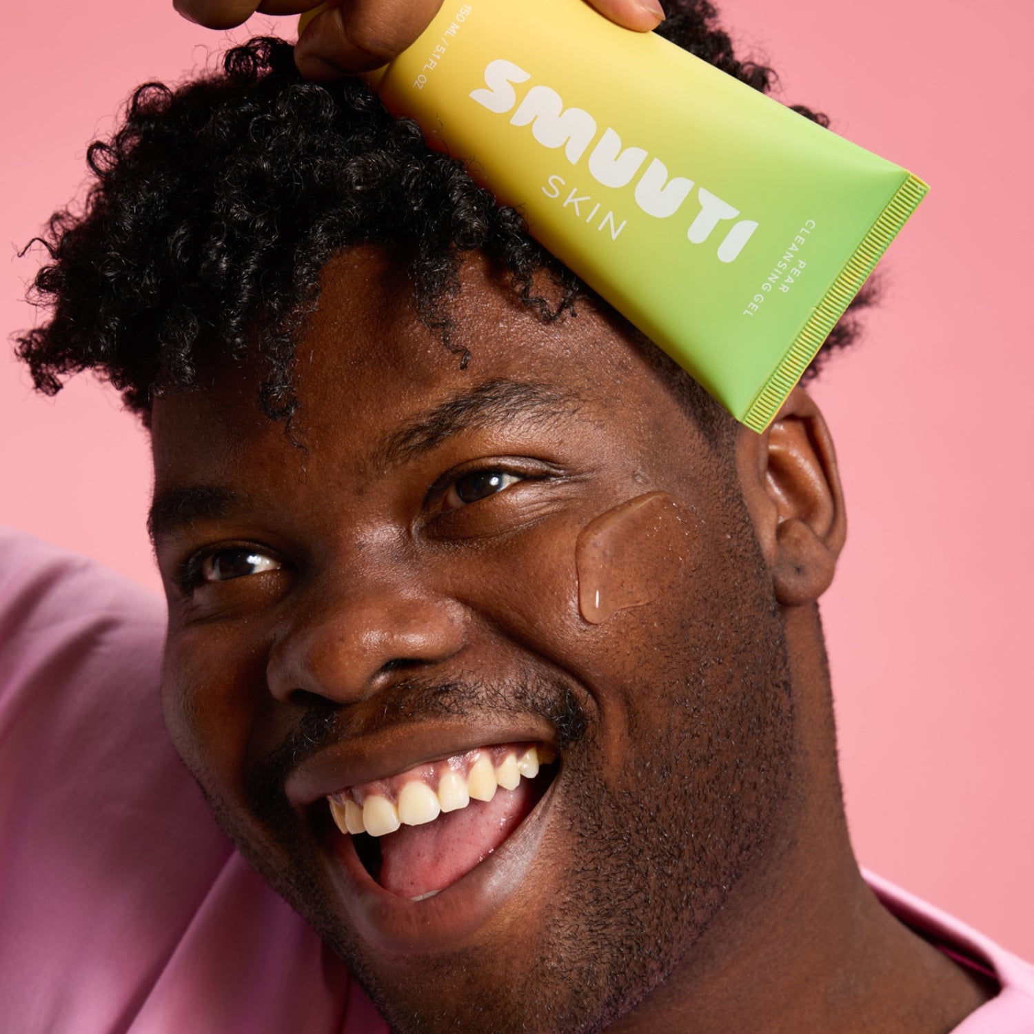 model holding smuuti skin pear cleansing gel