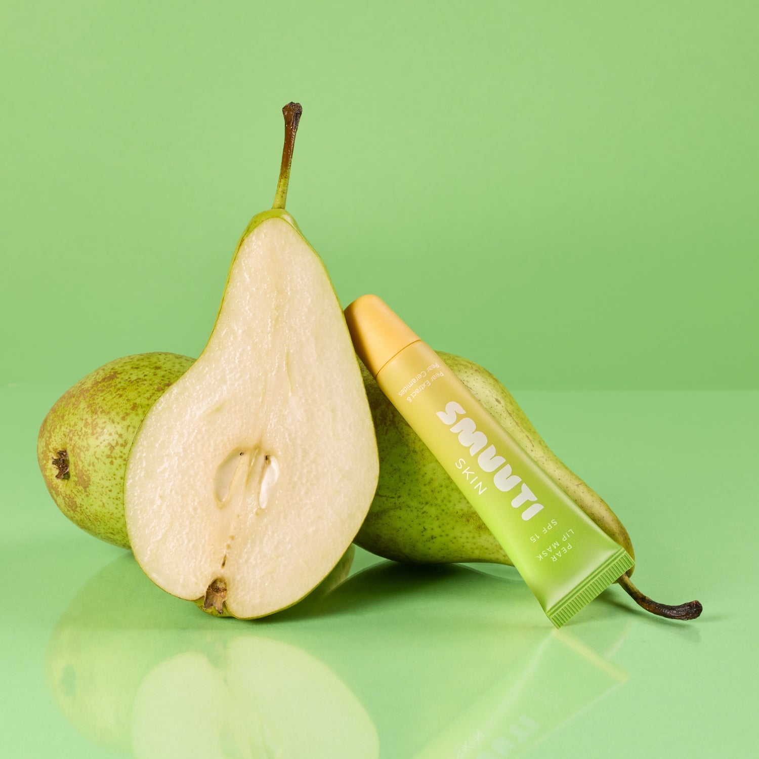 Pear and smuuti skin pear lip mask on a green background
