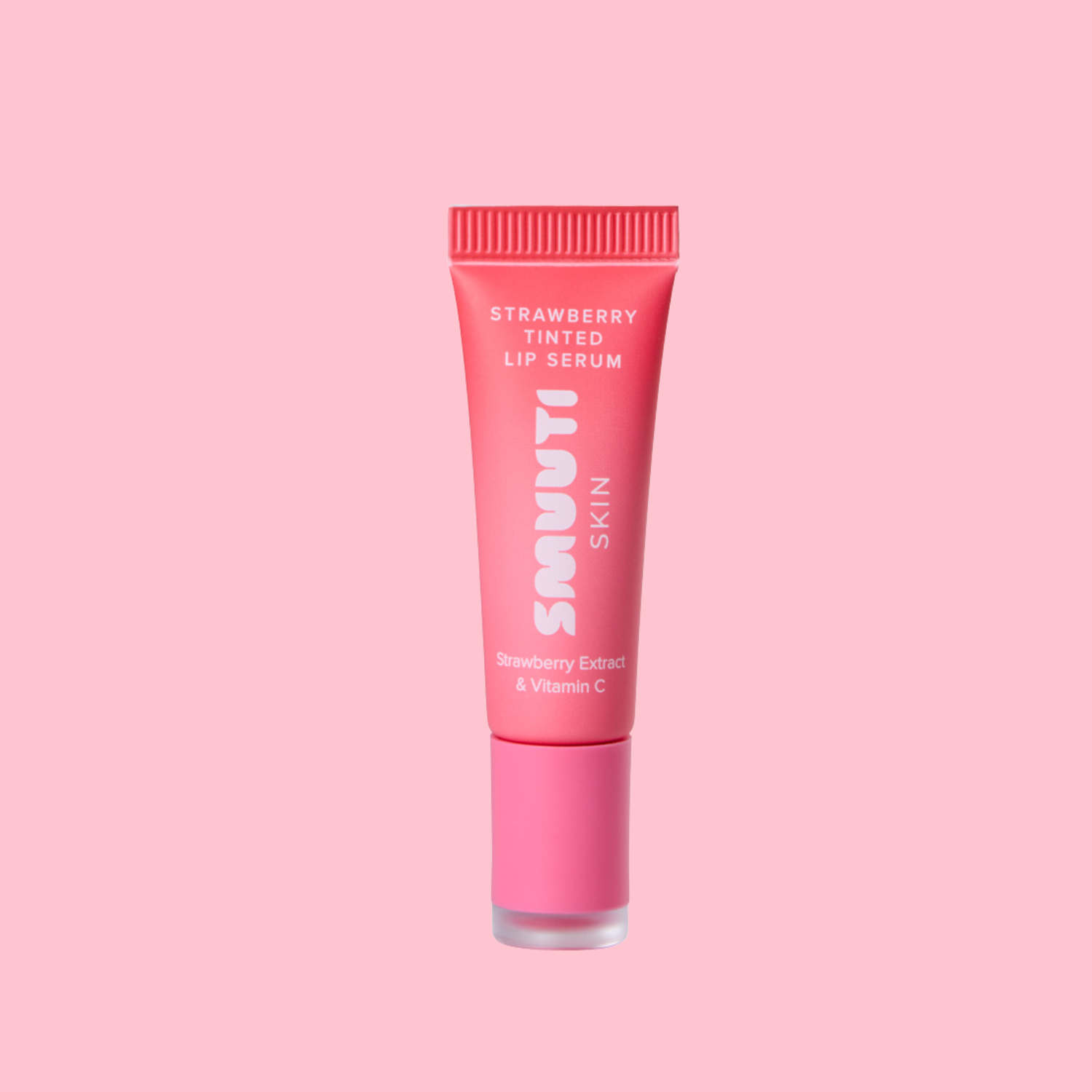A pink squeeze tube of Smuuti Skin Strawberry Tinted Lip Serum, centered on a solid light pink background.