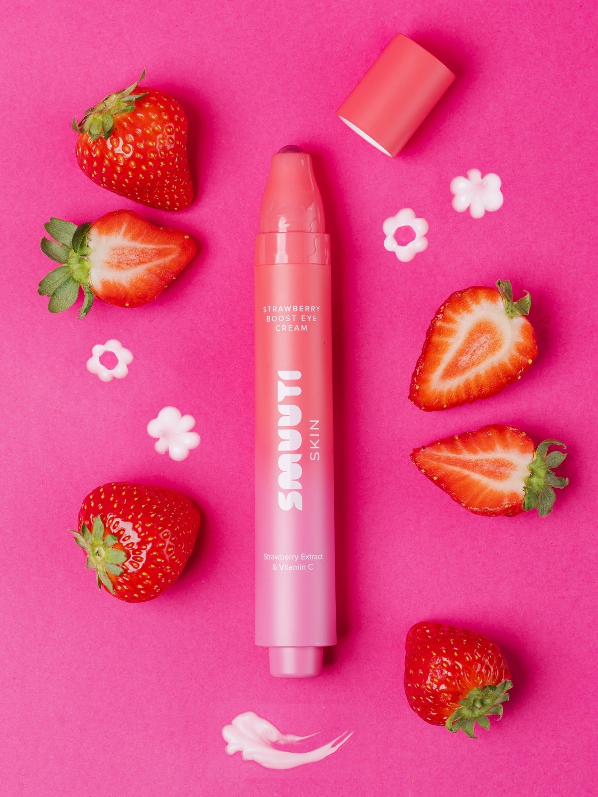 Smuuti Skin strawberry boost eye cream with strawberries on a pink background