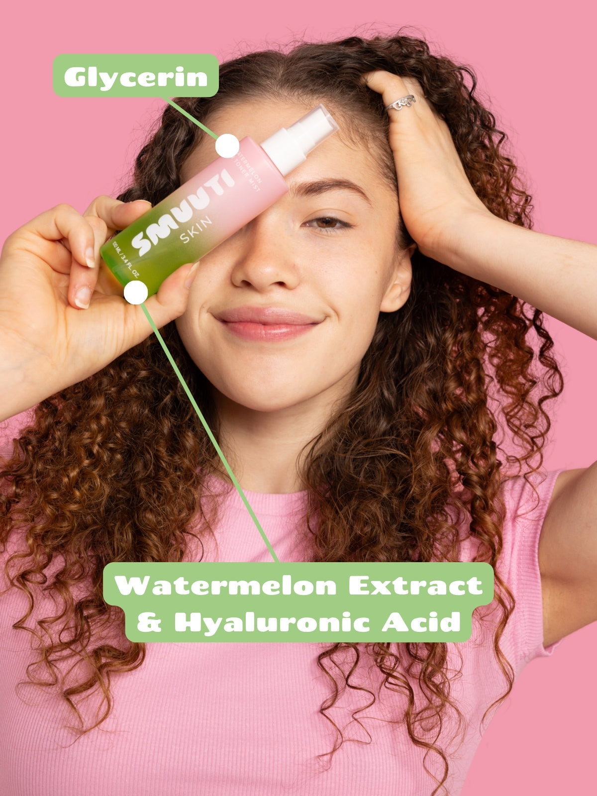 Person holding Smuuti Skin watermelon dew toner mist with text about ingredients on a pink background