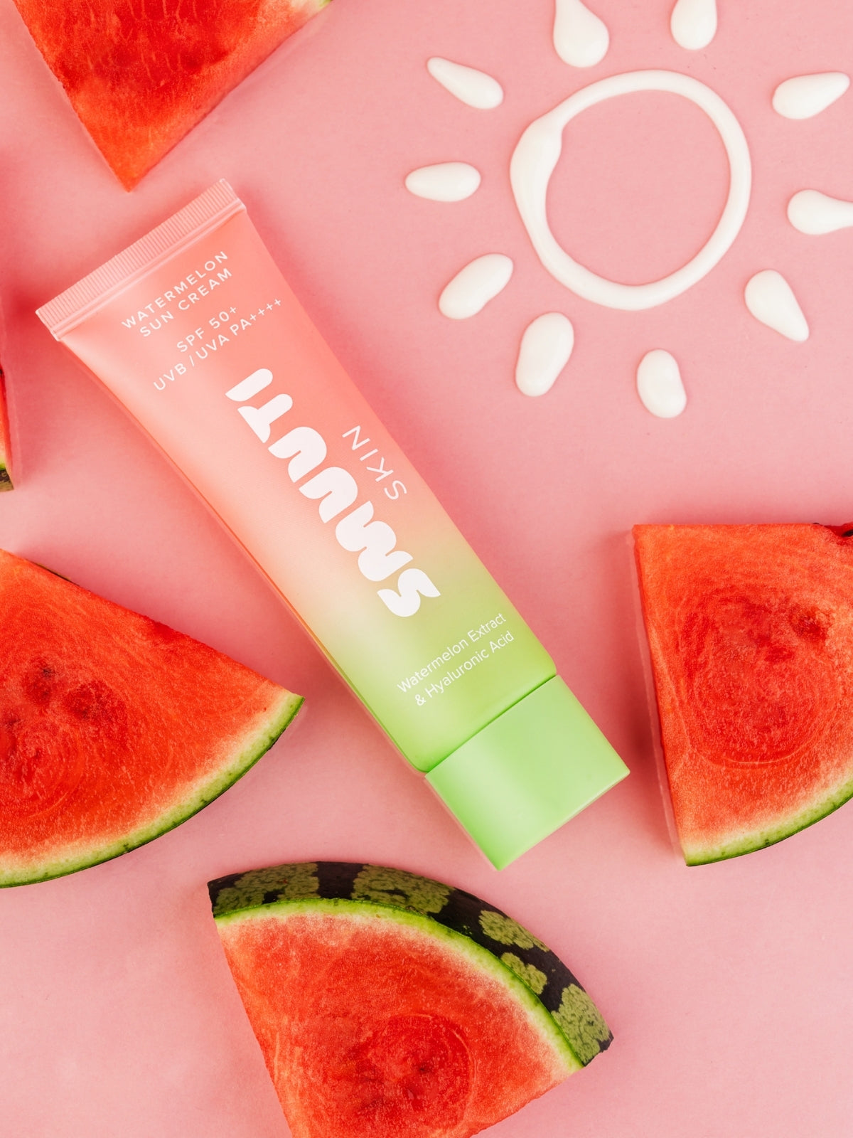 Smuuti Skin watermelon sun cream with watermelon slices on a pink background