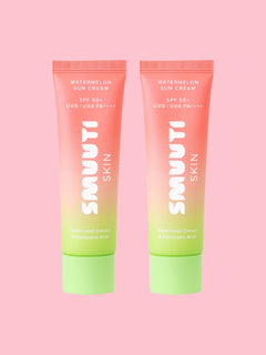 Two tubes of Smuuti Skin watermelon sun cream on a pink background