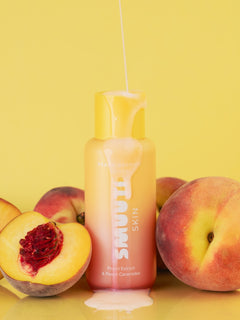 Smuuti Skin peach barrier toner with peaches on a yellow background