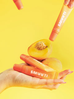 Smuuti Skin peach lip masks with a peach on a yellow background