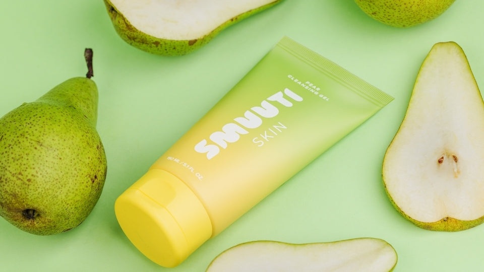 Smuuti Skin Pear Cleansing Gel on a green background with pears