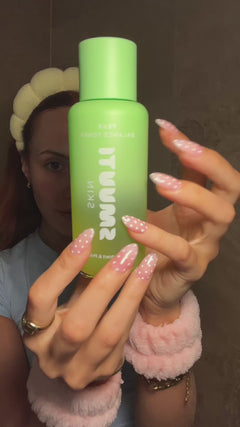 model using and applying Smuuti Skin pear balance toner in bathroom