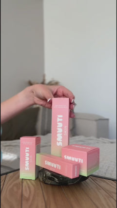 closeup video of person opening a new Smuuti Skin watermelon dew toner mist and spraying it onto their face