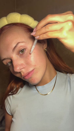 person applying Smuuti Skin pear balance serum to their face