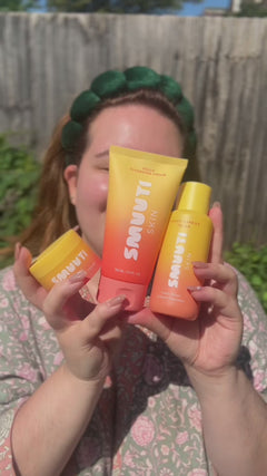 person outside in the sunshine using Smuuti Skin peach barrier skincare products