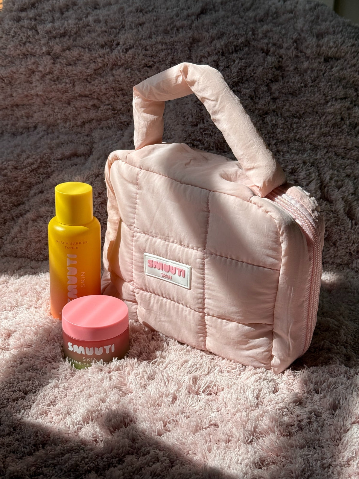 Smuuti Skin puffy cosmetic bag with Smuuti Skin products