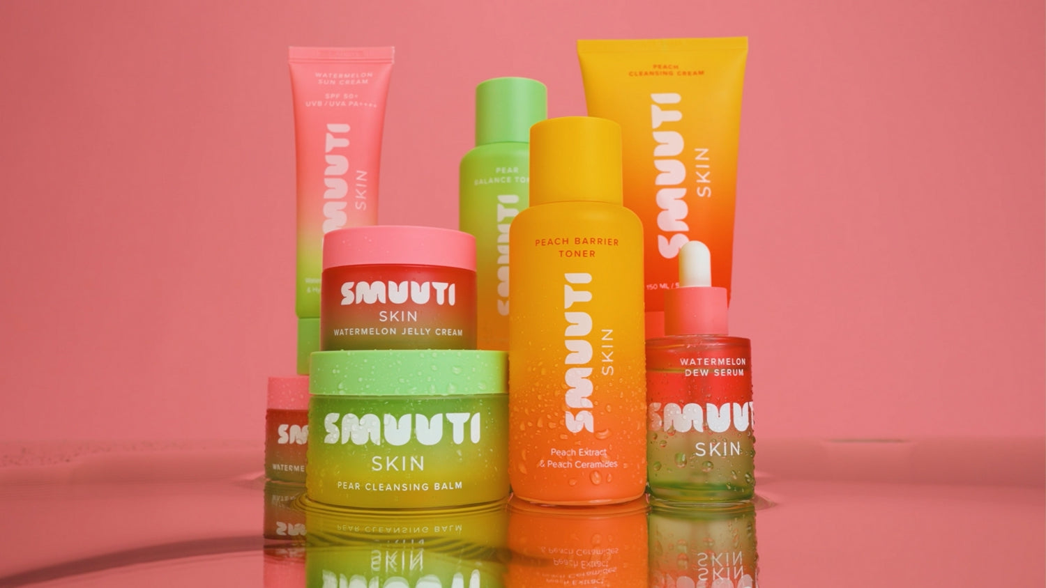 Collection of Smuuti Skin skincare products on a pink background