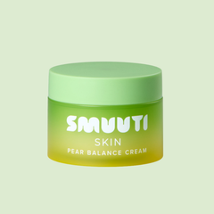 A jar of SMUUTI Skin Pear Balance Cream with a light green lid and a yellow-green gradient container, set against a solid pale green background.