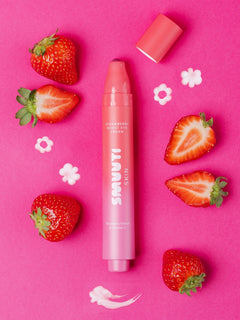 Smuuti Skin strawberry boost eye cream with strawberries on a pink background