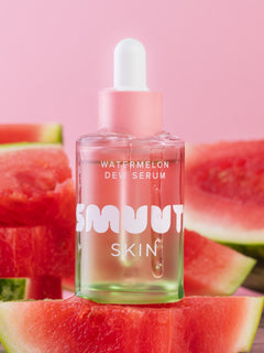 Smuuti Skin Watermelon dew serum bottle with watermelon slices on a pink background