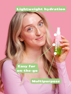 Woman holding a bottle of Smuuti Skin watermelon dew toner mist on a pink background