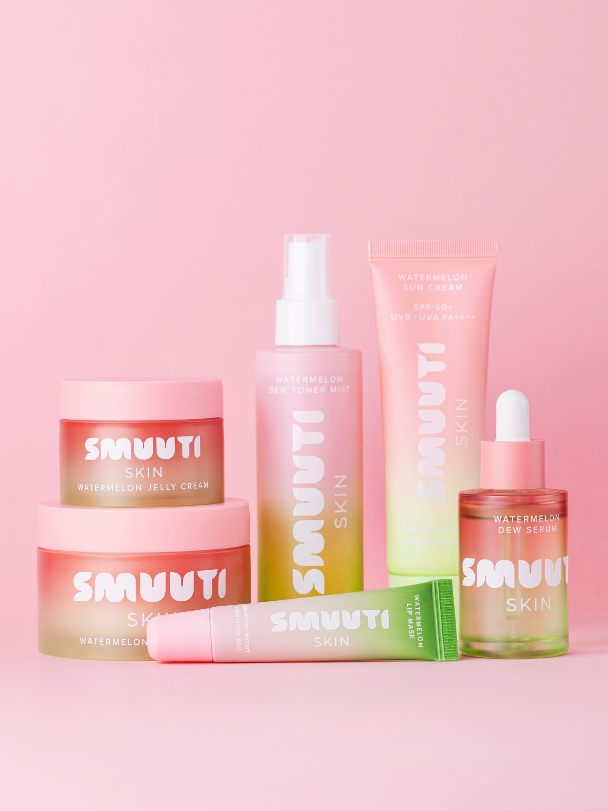 SMUUTI watermelon dew skincare products on a pink background